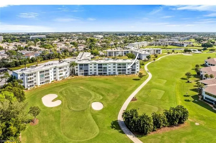 This property offers stunning views of the golf course, featuring expansive green lawns and sand traps