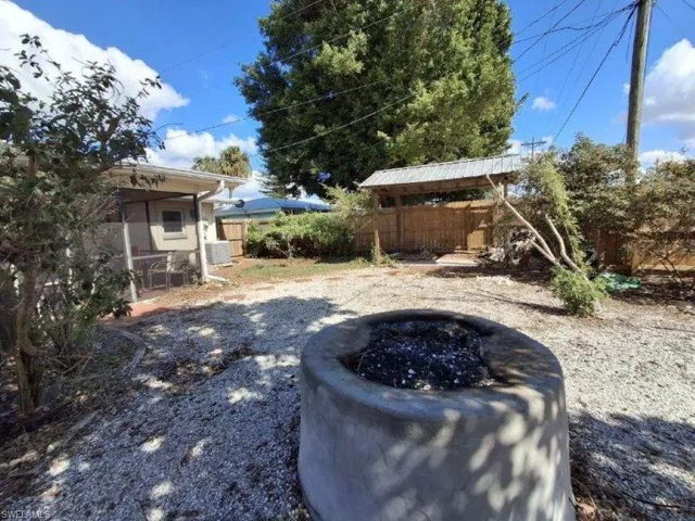 View of yard with a fire pit