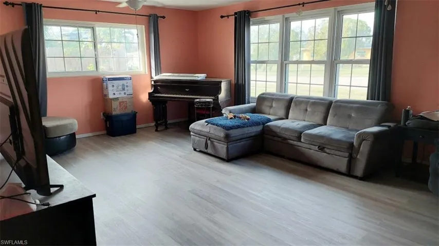 Living room with light wood-type flooring