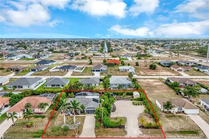Aerial perspective of suburban area with property parcel outlined