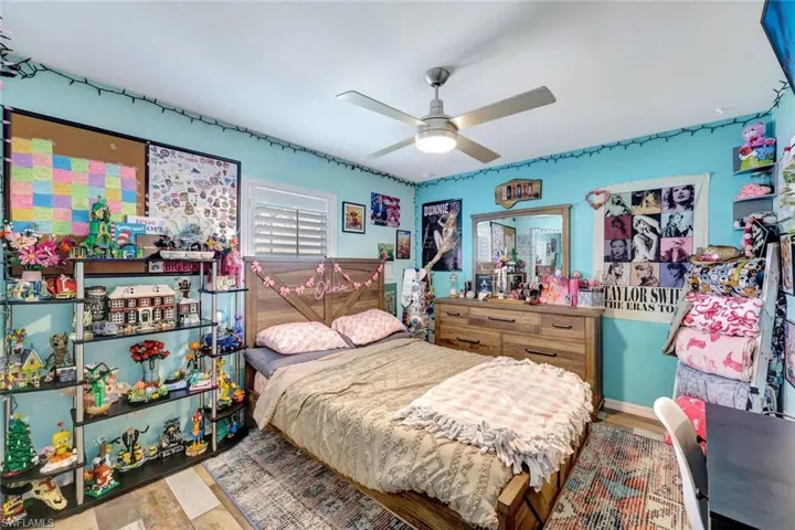 Bedroom featuring wood finished floors and a ceiling fan