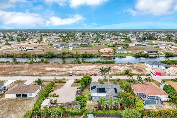 Aerial view of residential area with a large body of water