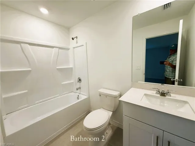 Full bath featuring vanity and bathtub / shower combination
