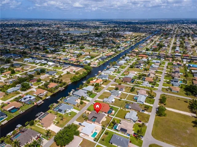Aerial view with a water view and a residential view