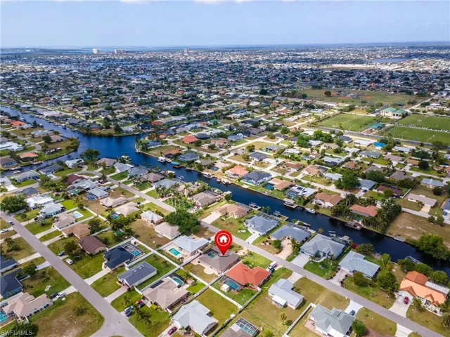Drone / aerial view featuring a water view and a residential view