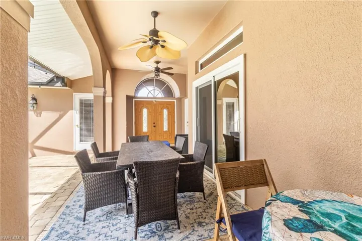View of patio / terrace featuring outdoor dining space and a ceiling fan