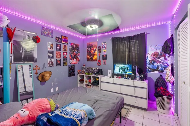 Tiled bedroom with ceiling fan