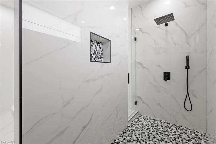 Bathroom featuring tiled shower