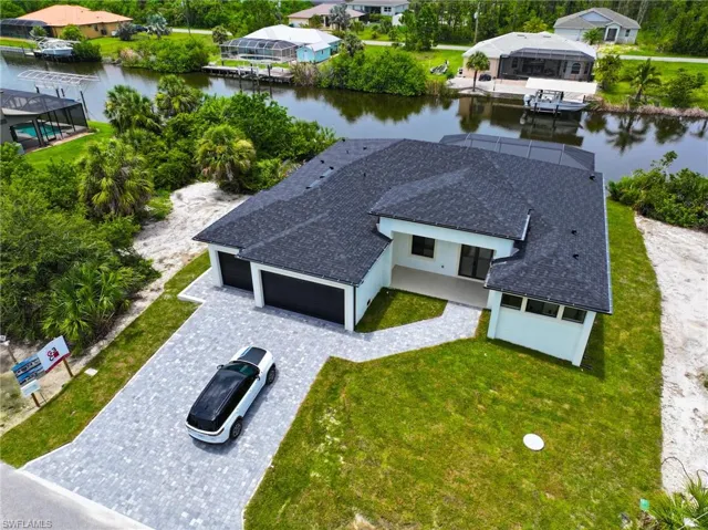 View from above of property with a large body of water