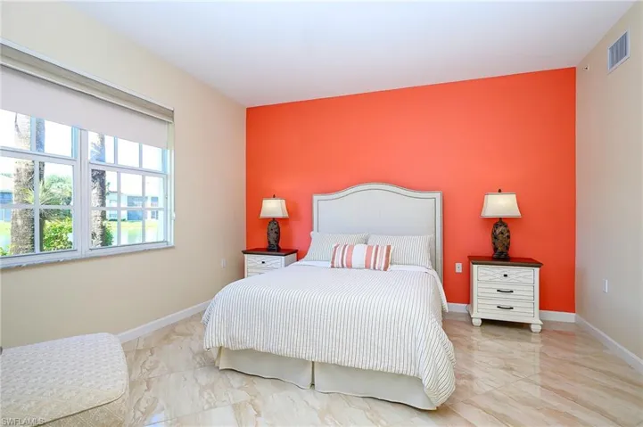Master Bedroom featuring light porcelain finish floors