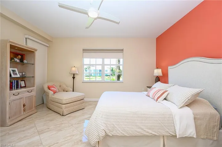 Master Bedroom with a ceiling fan and light porcelain flooring