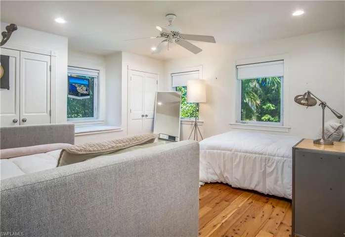 Bedroom featuring light wood-type flooring and ceiling fan