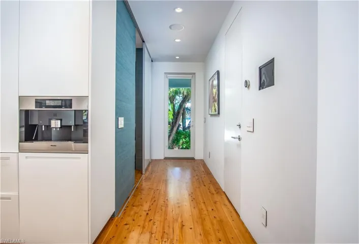 Corridor featuring light hardwood / wood-style flooring
