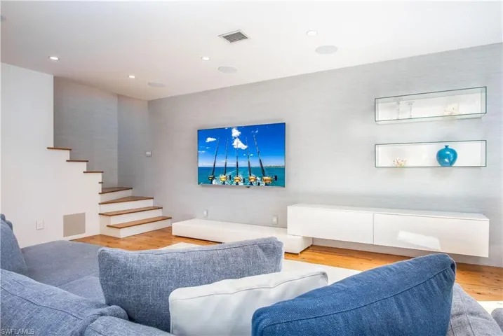 Living room with light wood-type flooring