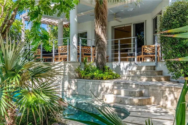 View of exterior entry with ceiling fan