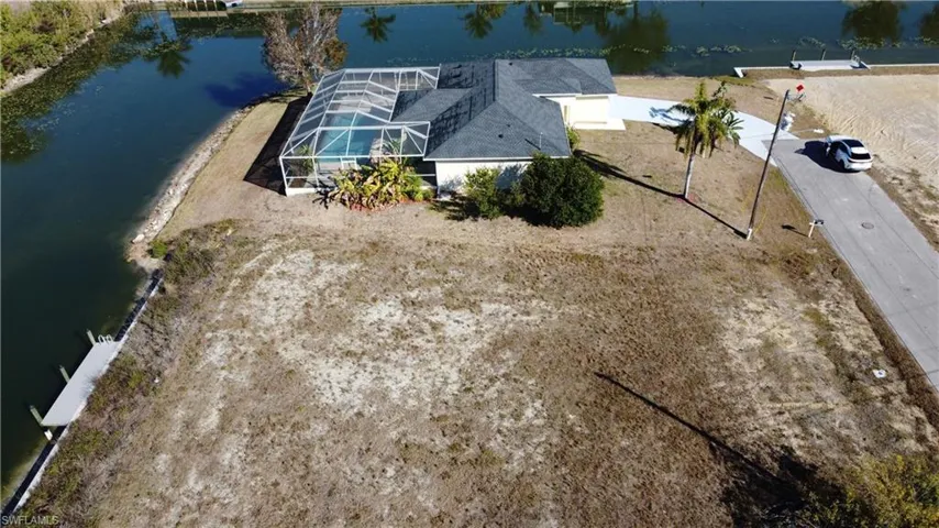 View from above of property with a large body of water