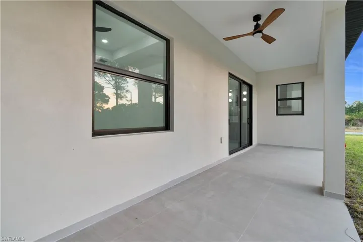 View of patio featuring a ceiling fan