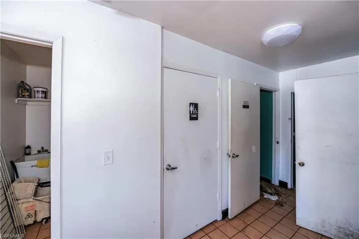 Corridor with light tile patterned floors