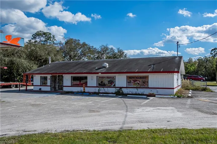View of front of house with uncovered parking
