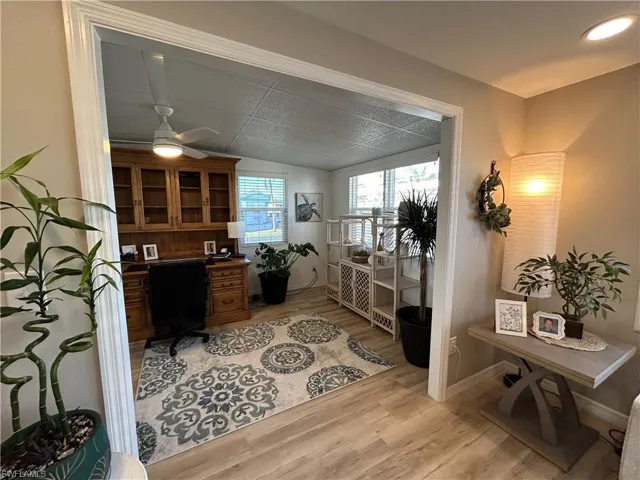 Office space featuring light hardwood / wood-style floors and ceiling fan