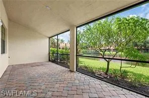 Unfurnished sunroom with a patio area and plenty of natural light