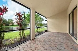 Unfurnished sunroom featuring a water view