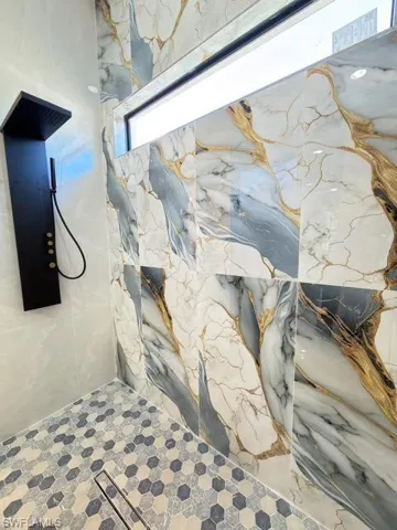 Bathroom view of a marble finish shower