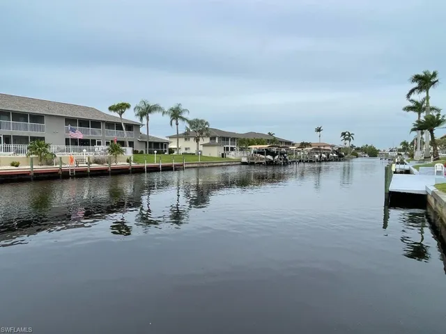 Water view featuring a dock