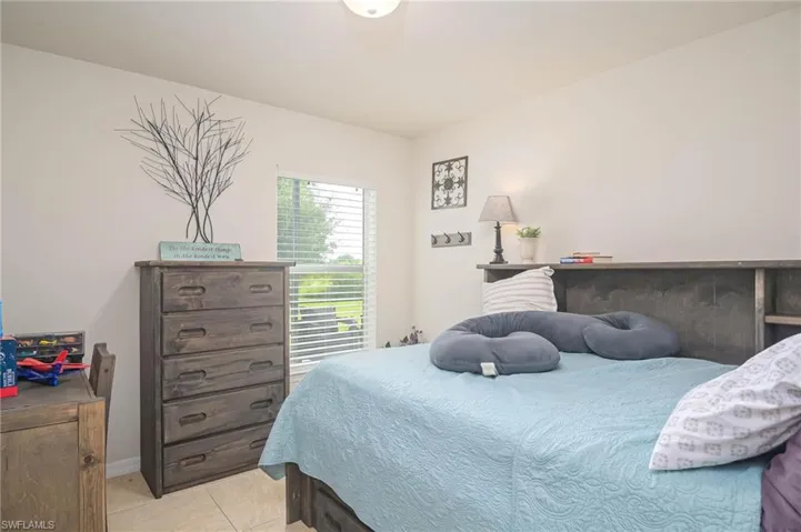Bedroom featuring light tile patterned flooring