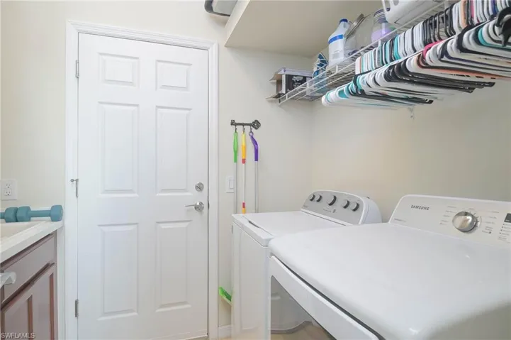 Laundry area featuring washing machine and clothes dryer