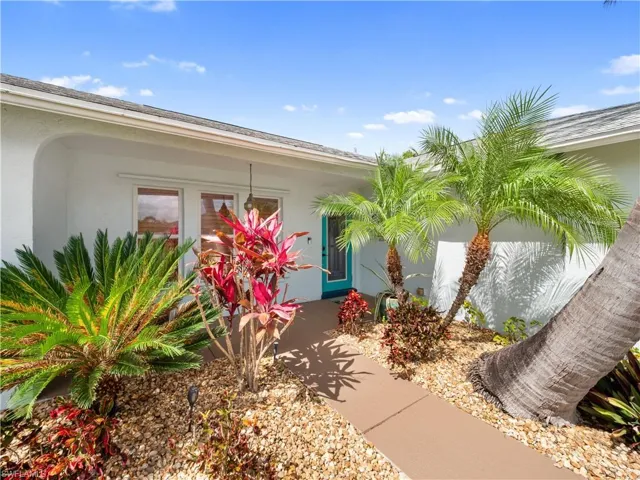 Entrance to property with stucco siding