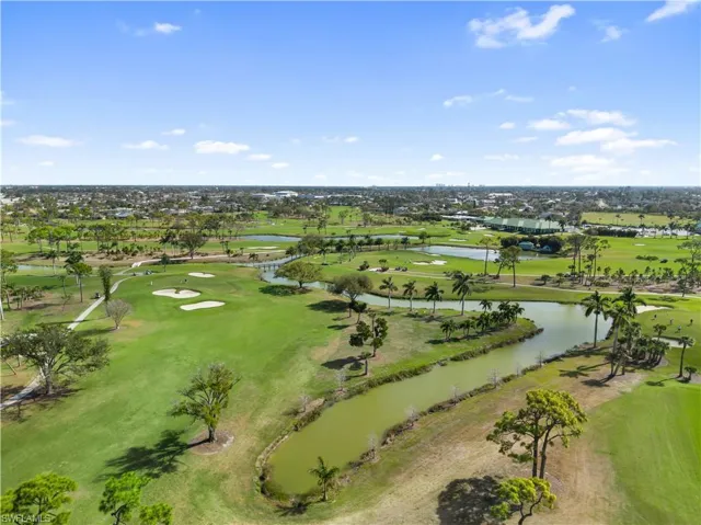 Bird's eye view of a golf course and a large body of water