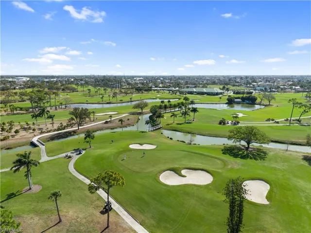 Bird's eye view of a local golf course and a large body of water