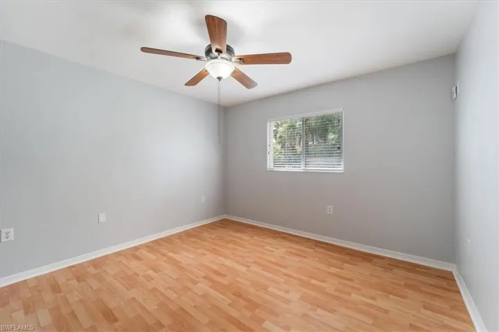 Spare room featuring light wood finished floors and a ceiling fan