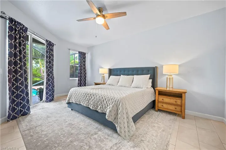 Bedroom with tile flooring and ceiling fan
