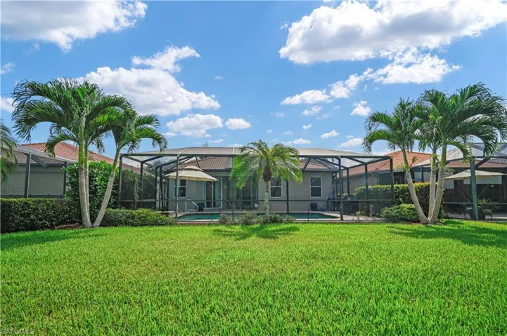 View of yard with a lanai