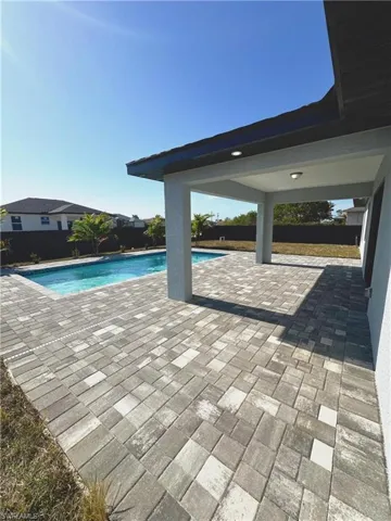 View of swimming pool with a patio