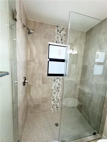 Bathroom featuring a shower with shower door