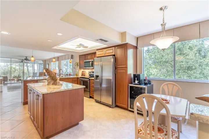 Kitchen viewed from dining area with another lovely preserve view