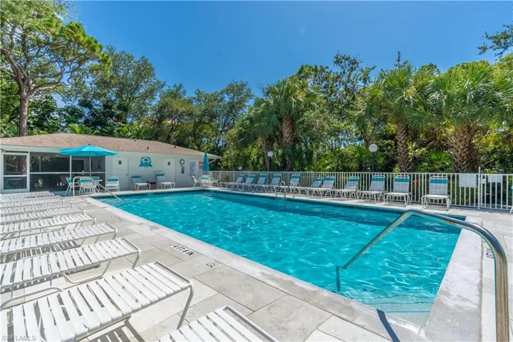 View of Naples Cove swimming pool featuring a patio area