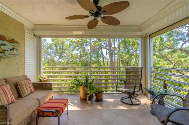 Bright Lanai with tree top view of preserve