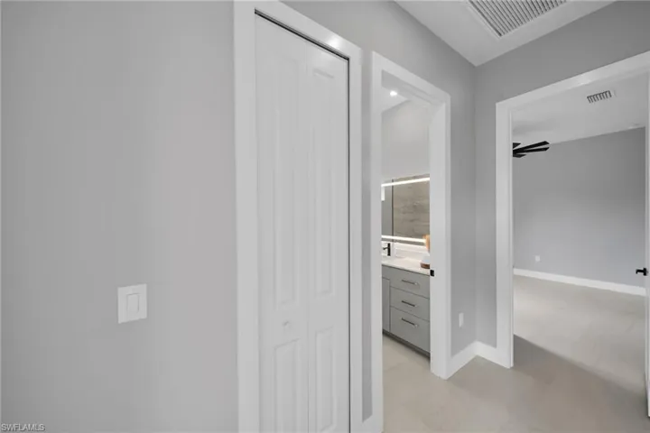 Hall featuring baseboards