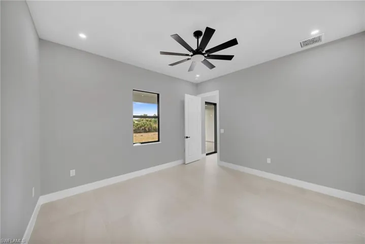 Empty room with recessed lighting, ceiling fan, and light floors