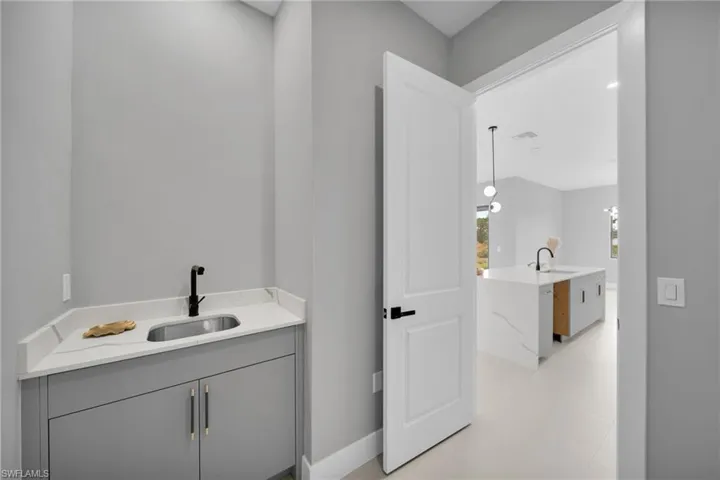 Bathroom featuring vanity and light flooring