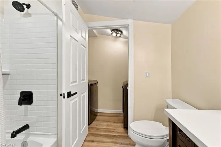 White subway tile shower surround with matte black fixtures
