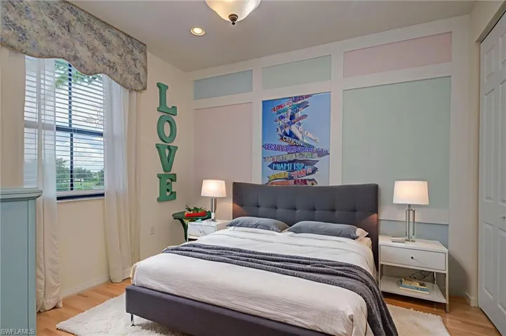 Bedroom featuring light wood-type flooring and recessed lighting