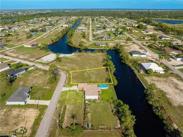 Aerial view of residential area with a large body of water