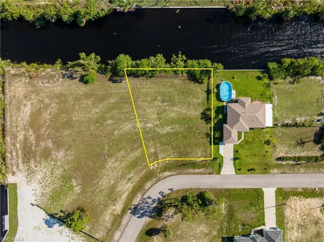 Aerial overview of property's location featuring property boundaries highlighted