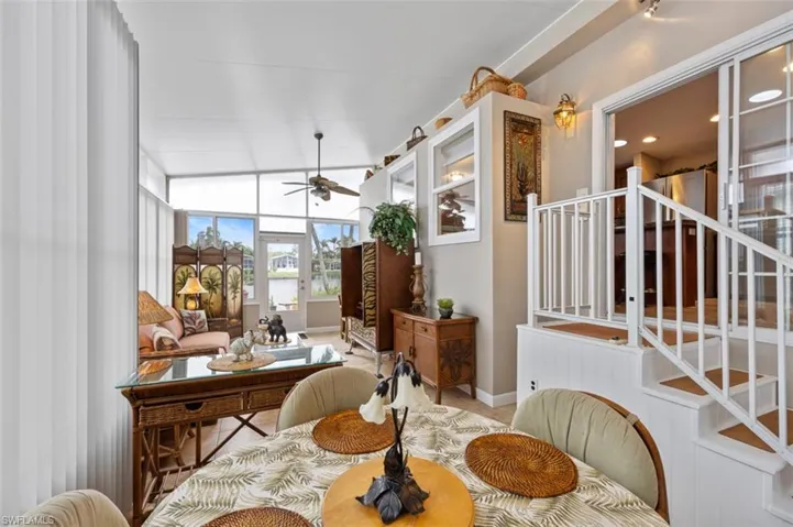 Dining space with ceiling fan and lofted ceiling