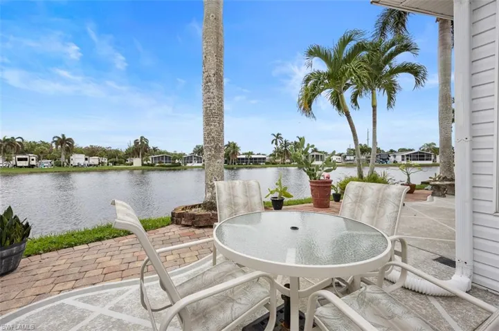 View of patio with a water view